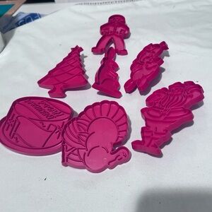 Vintage red Tupperware cookie cutters in great shape. Collectible